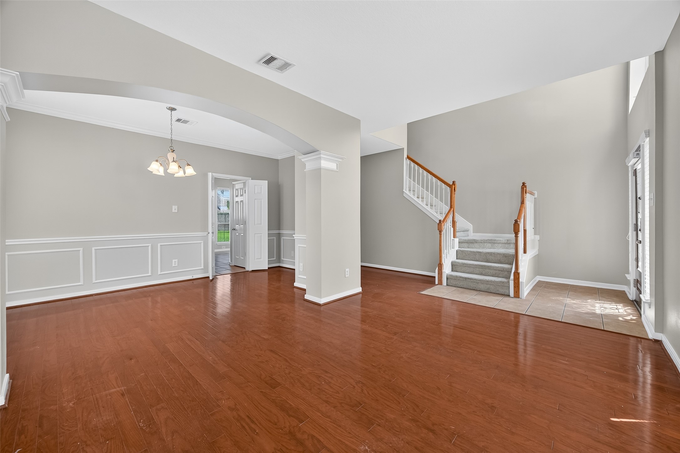 12902 Crystal Reef Court Pearland, TX 77584 - Photo 4 of 35 a view of empty room with wooden floor and fireplace