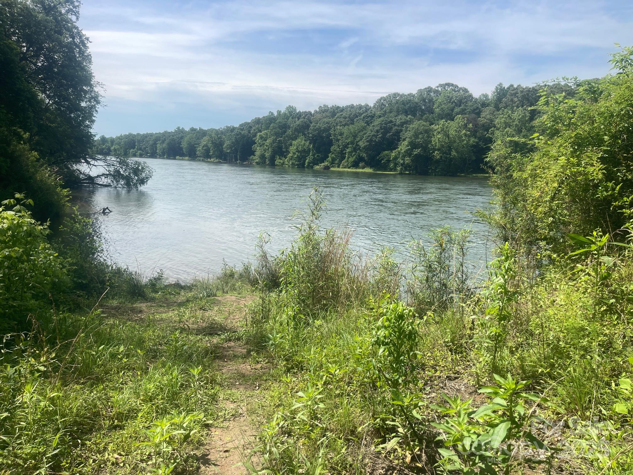 Lot 149 Lookout Dam Road Statesville, NC 28625 - Photo 7 of 8 a view of a lake with a city