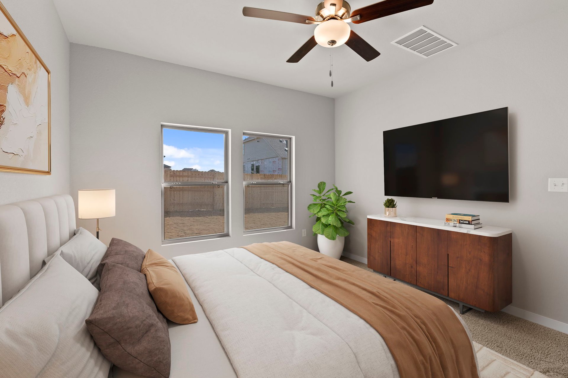13613 Gray Landing Drive Elgin, TX 78621 - Photo 7 of 33 a bedroom with a bed and a flat screen tv