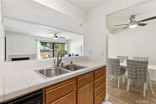 a kitchen with a sink cabinets and window