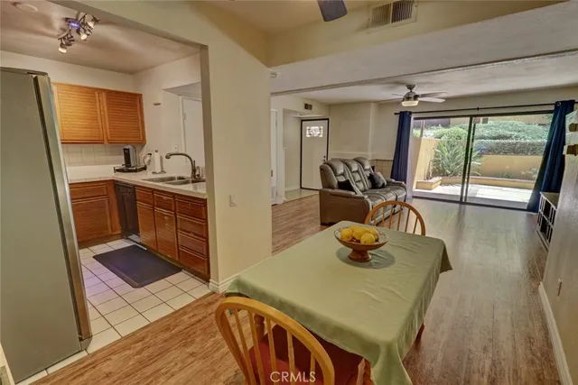 a kitchen with a sink a stove and cabinets
