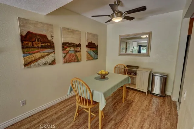 a kitchen with stainless steel appliances kitchen island granite countertop a refrigerator and a sink