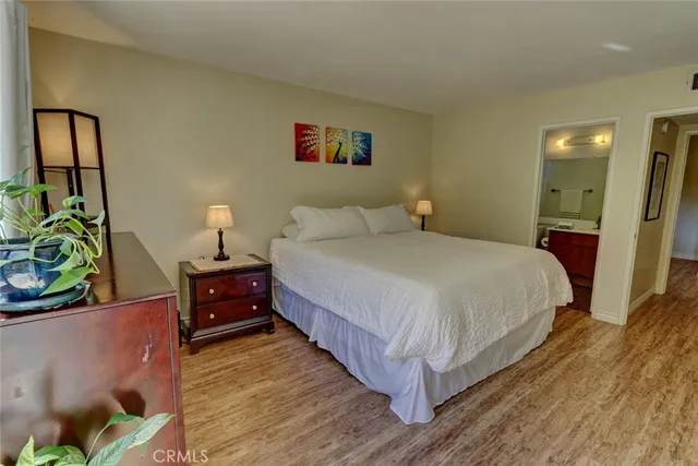 a bedroom with a large bed and a large window