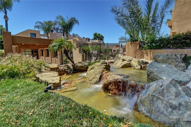 a view of a swimming pool with outdoor seating