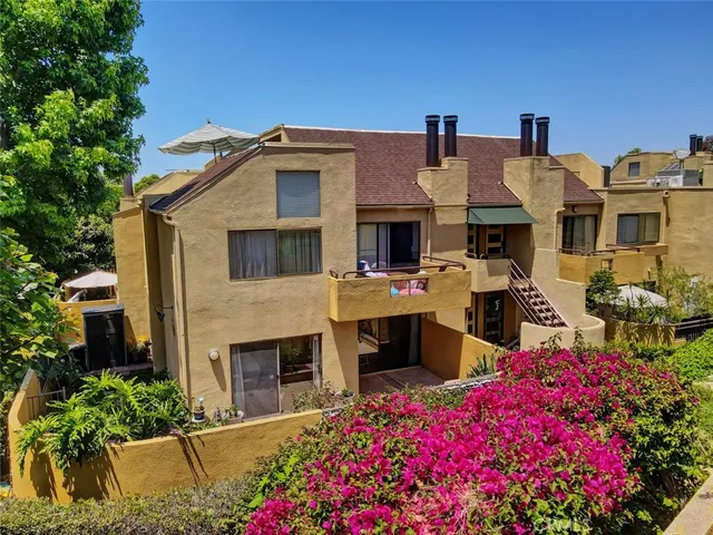 a view of a backyard with sitting area