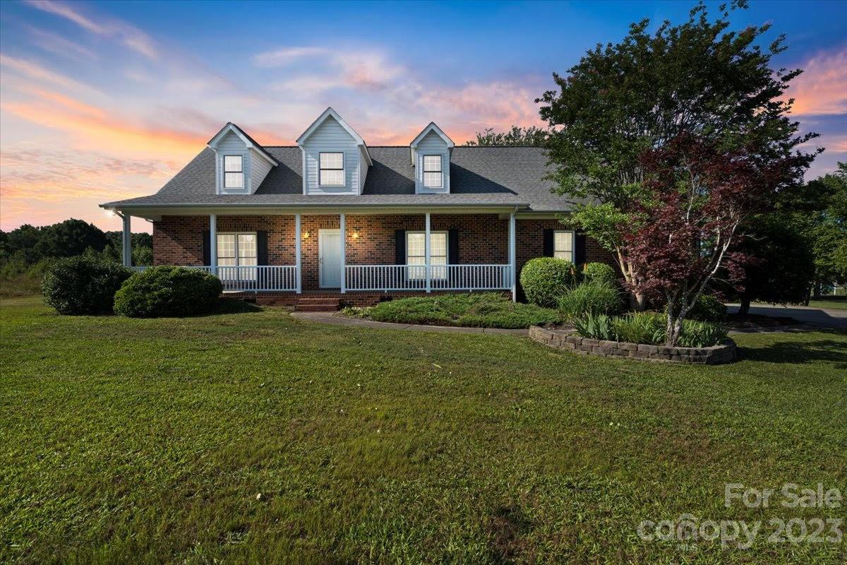 1531 Henry Smith Road Monroe, NC 28110 - Photo 1 of 31 a front view of a house with a yard