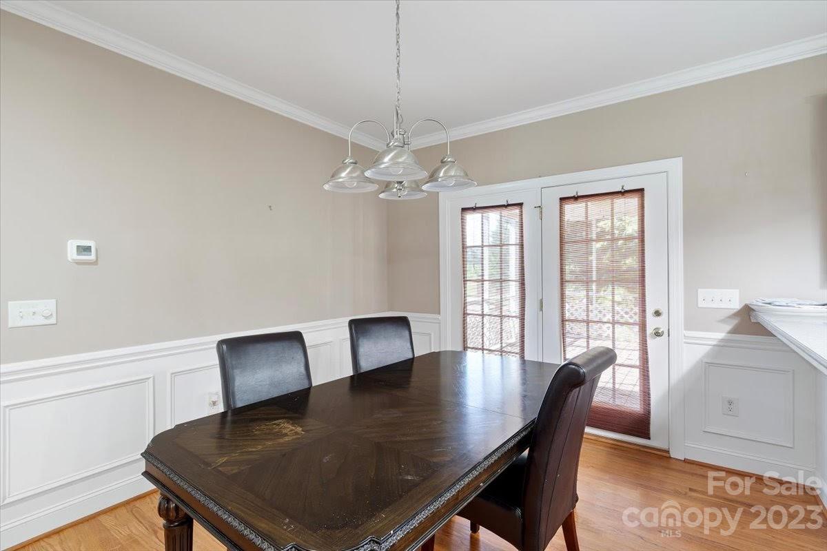 1531 Henry Smith Road Monroe, NC 28110 - Photo 11 of 31 a view of a dining room with furniture window and wooden floor