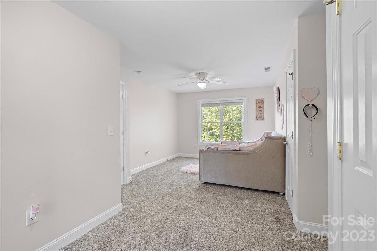1531 Henry Smith Road Monroe, NC 28110 - Photo 20 of 31 an empty room with windows