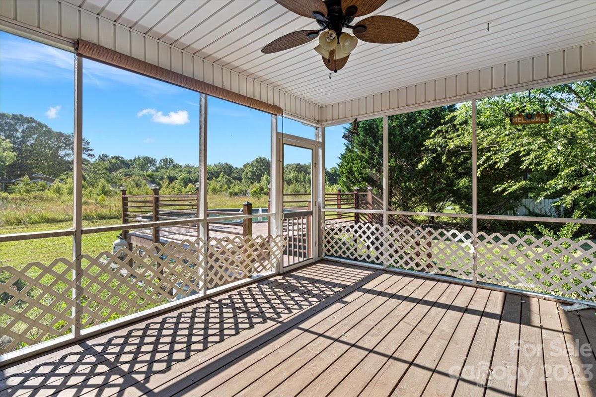 1531 Henry Smith Road Monroe, NC 28110 - Photo 26 of 31 a view of a balcony with wooden floor