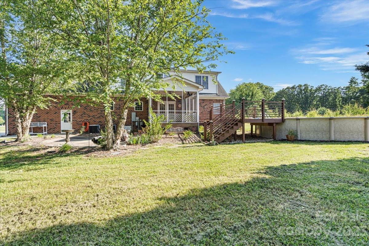 1531 Henry Smith Road Monroe, NC 28110 - Photo 28 of 31 a view of a house with a backyard