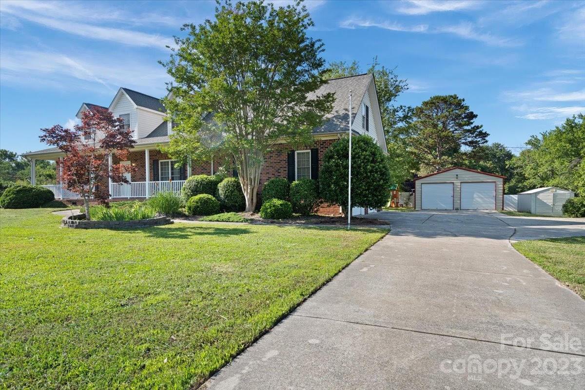 1531 Henry Smith Road Monroe, NC 28110 - Photo 3 of 31 a front view of a house with garden