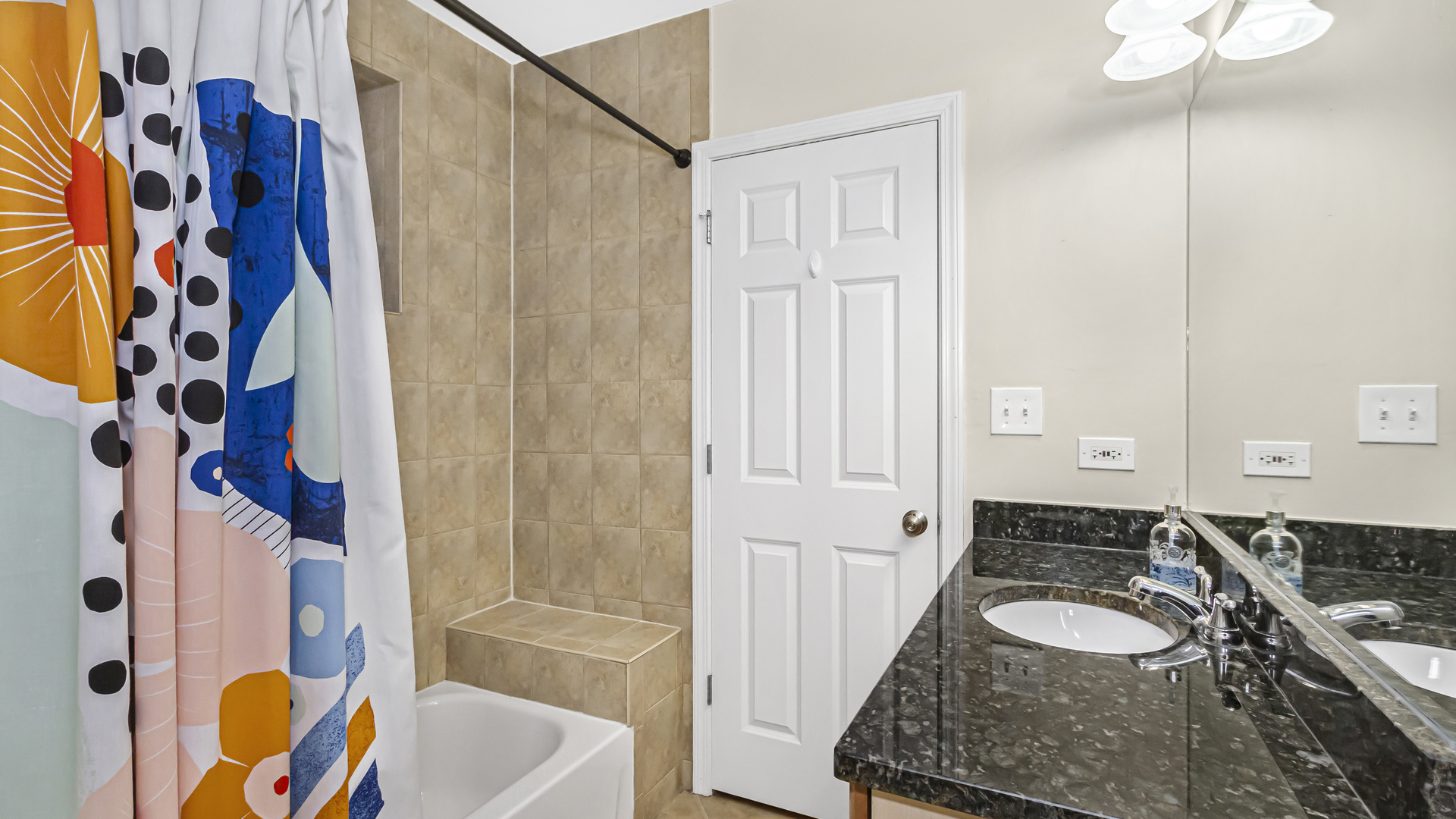 1430 West Chestnut Street, Unit 1 Chicago, IL 60642 - Photo 12 of 14 a bathroom with a sink and a bathtub