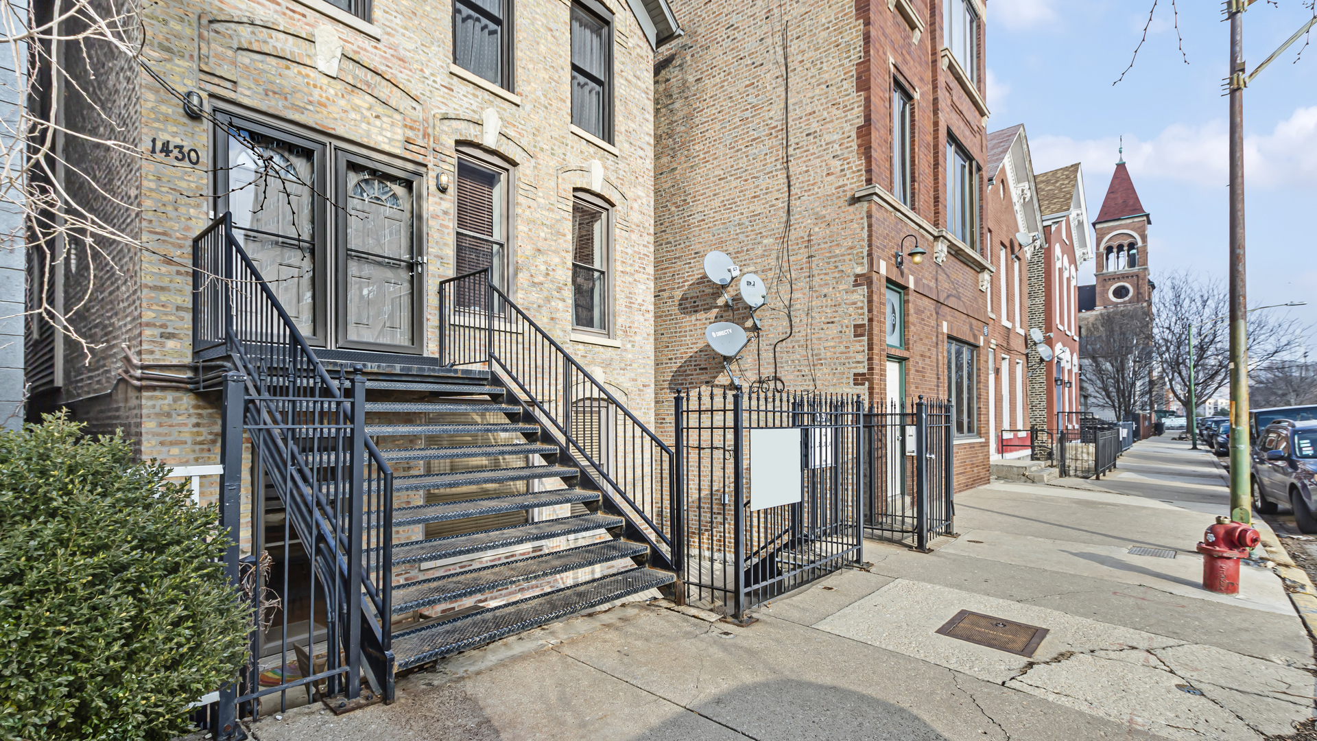 1430 West Chestnut Street, Unit 1 Chicago, IL 60642 - Photo 2 of 14 a view of a building along the street