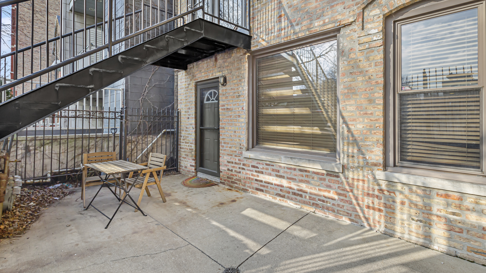 1430 West Chestnut Street, Unit 1 Chicago, IL 60642 - Photo 3 of 14 a view of a chairs and table in the balcony
