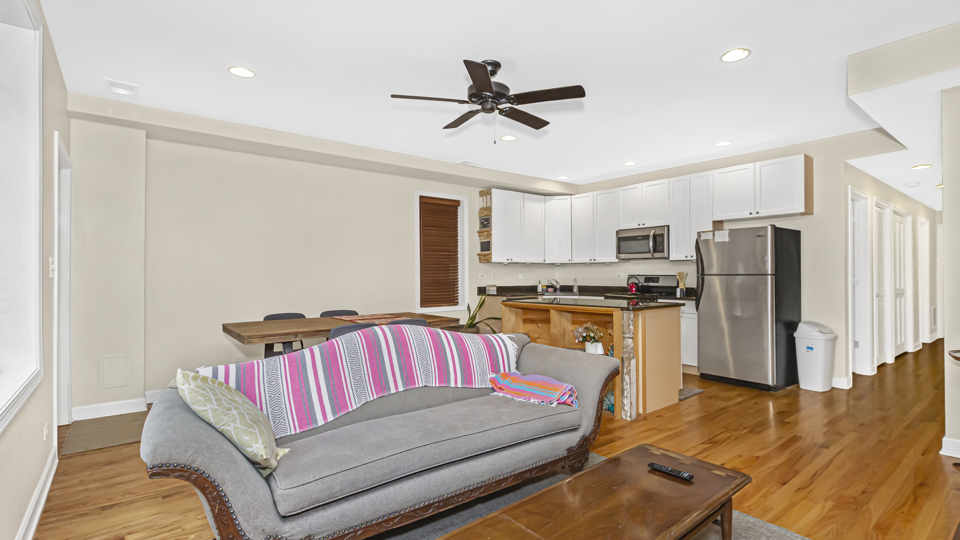 1430 West Chestnut Street, Unit 1 Chicago, IL 60642 - Photo 7 of 14 a living room with furniture kitchen view and a refrigerator