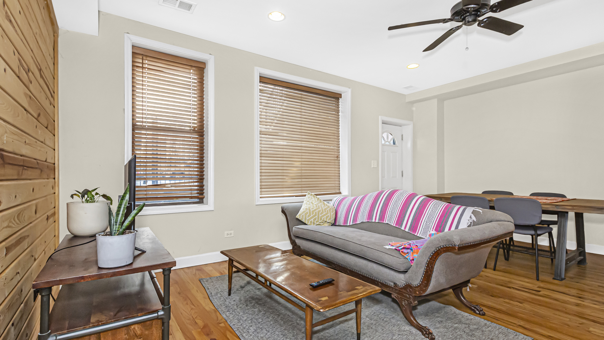 1430 West Chestnut Street, Unit 1 Chicago, IL 60642 - Photo 8 of 14 a living room with furniture and a potted plant