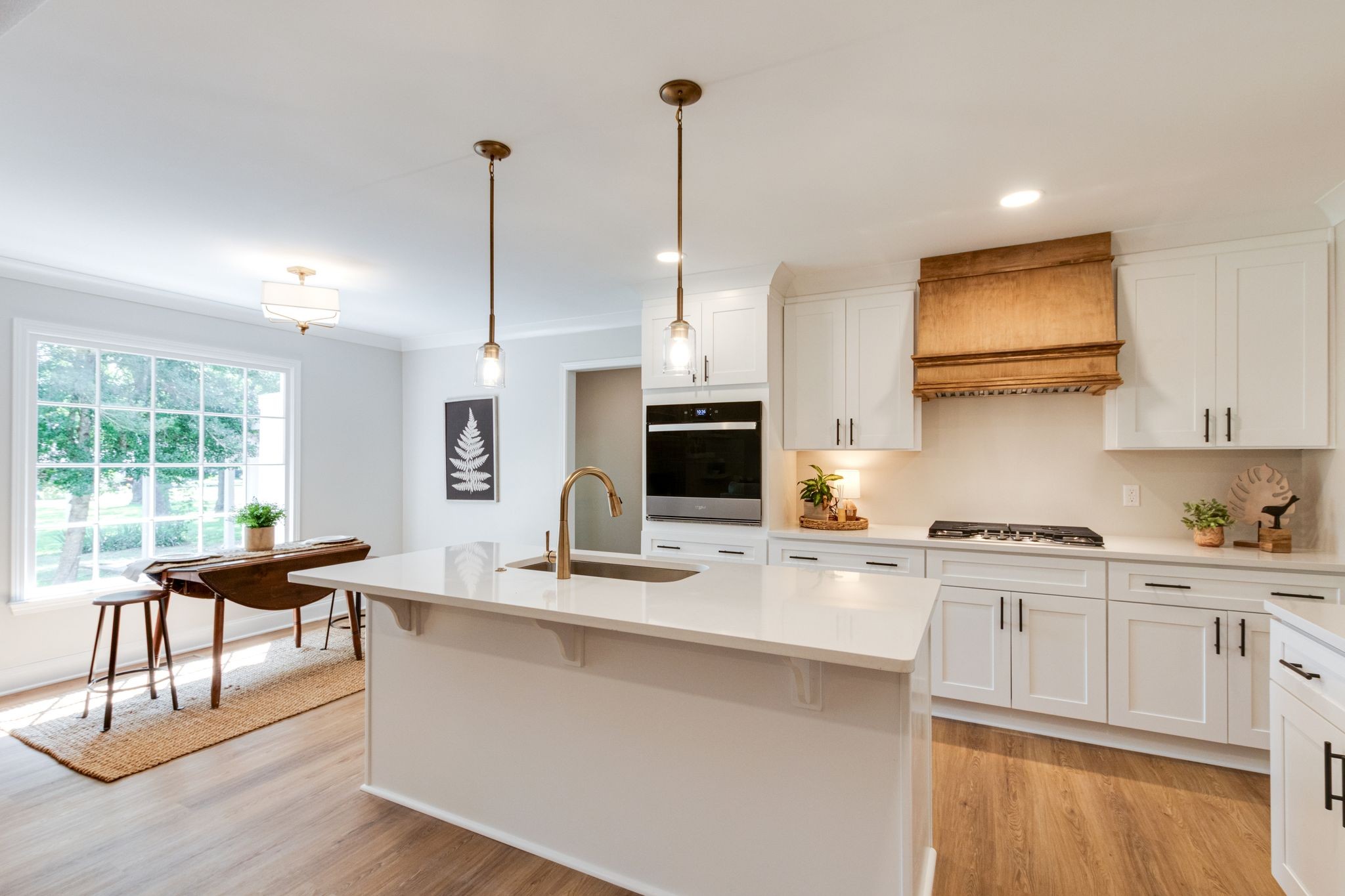 2302 Surrey Drive Murfreesboro, TN 37129 - Photo 12 of 26 a kitchen with kitchen island granite countertop a sink cabinets and wooden floor