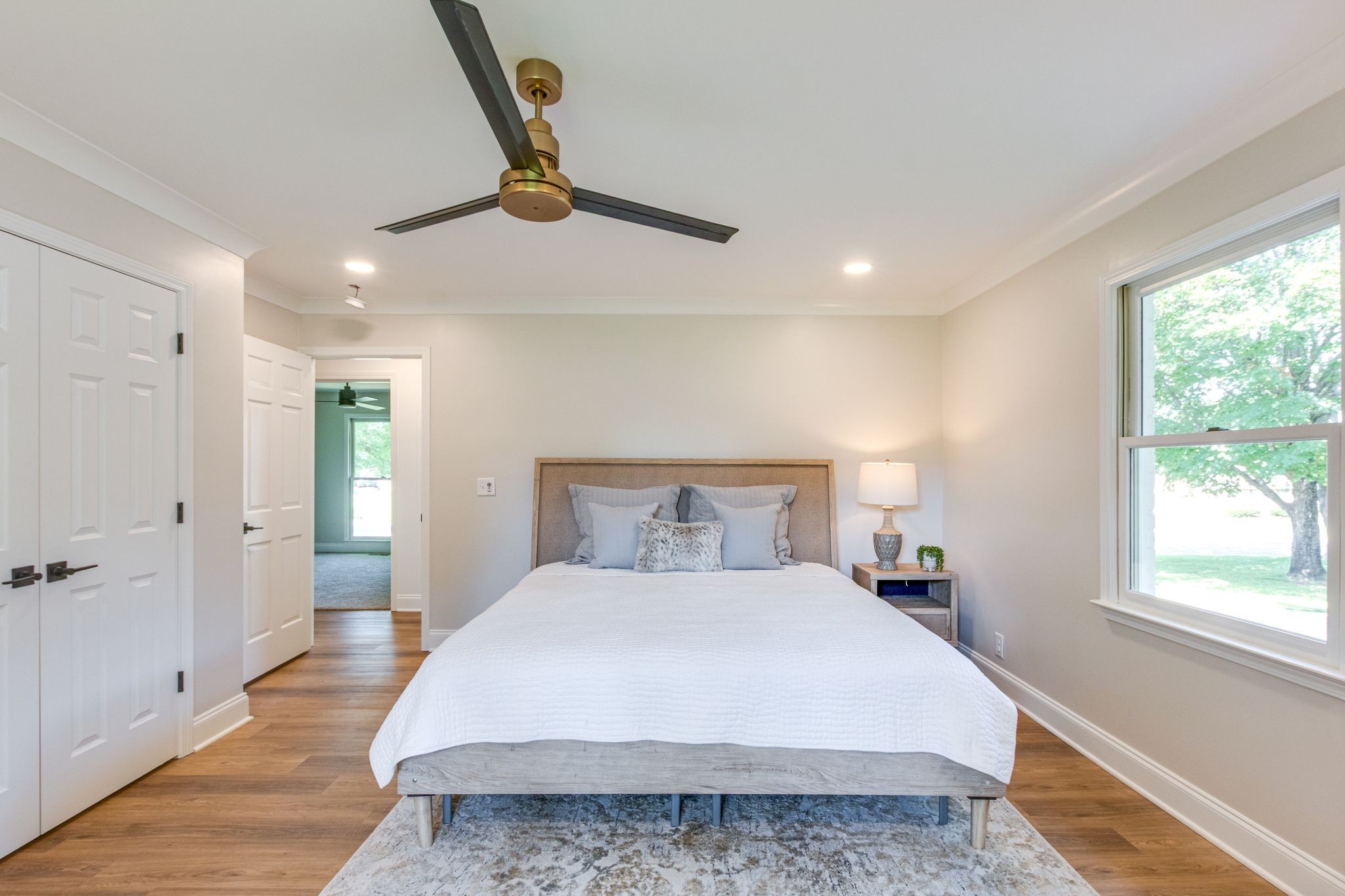 2302 Surrey Drive Murfreesboro, TN 37129 - Photo 14 of 26 a bedroom with a large bed and a chandelier