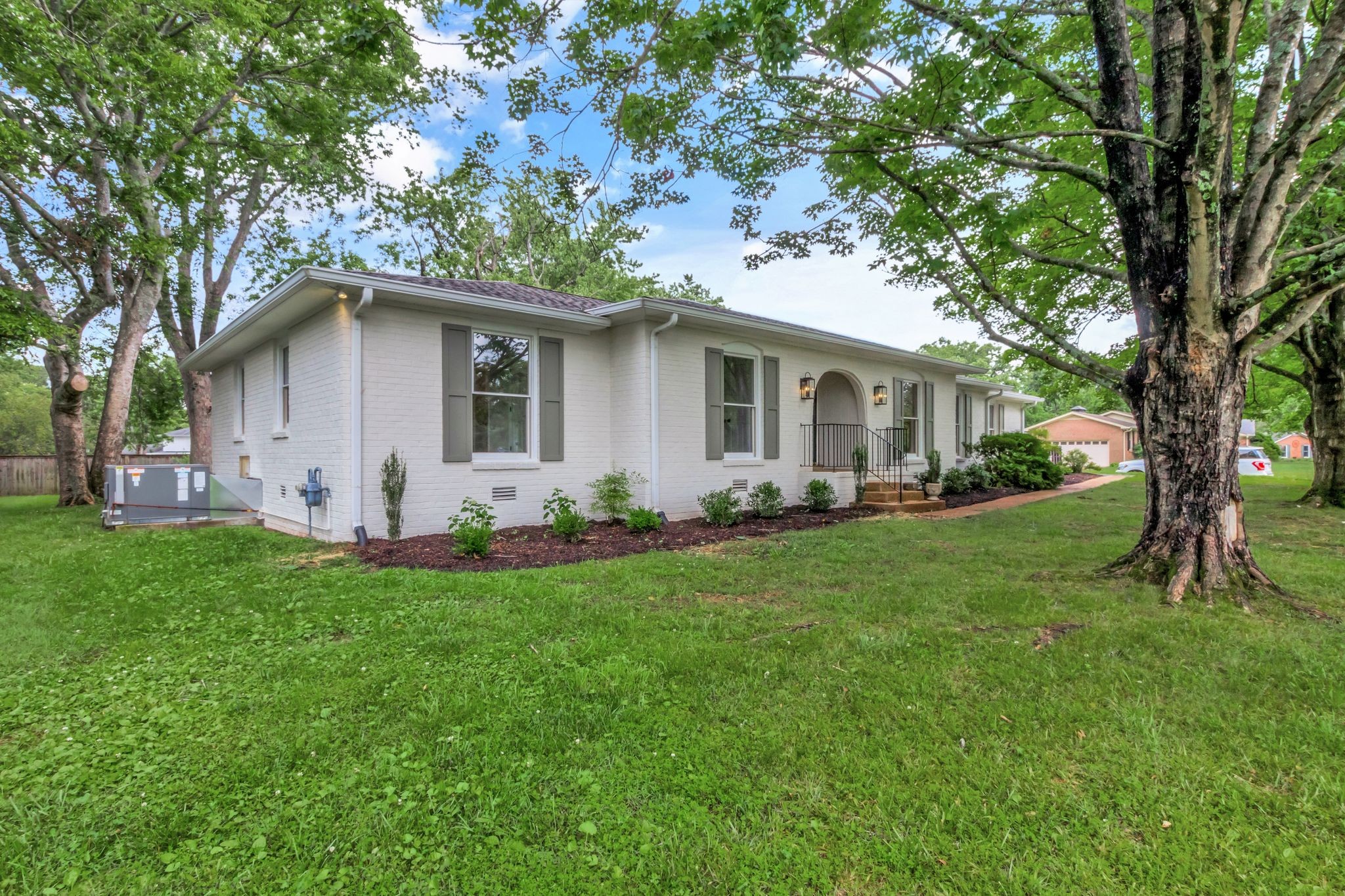 2302 Surrey Drive Murfreesboro, TN 37129 - Photo 3 of 26 a white house that has a tree in front of it