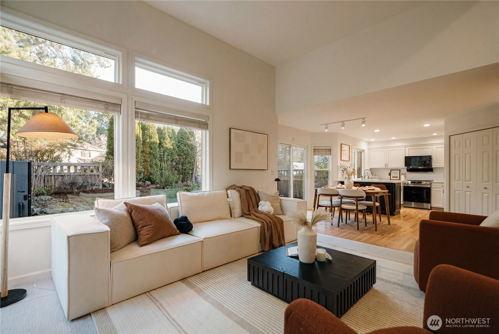 4016 243rd Place Southeast Issaquah, WA 98029 - Photo 11 of 35 a living room with furniture wooden floor and a large window