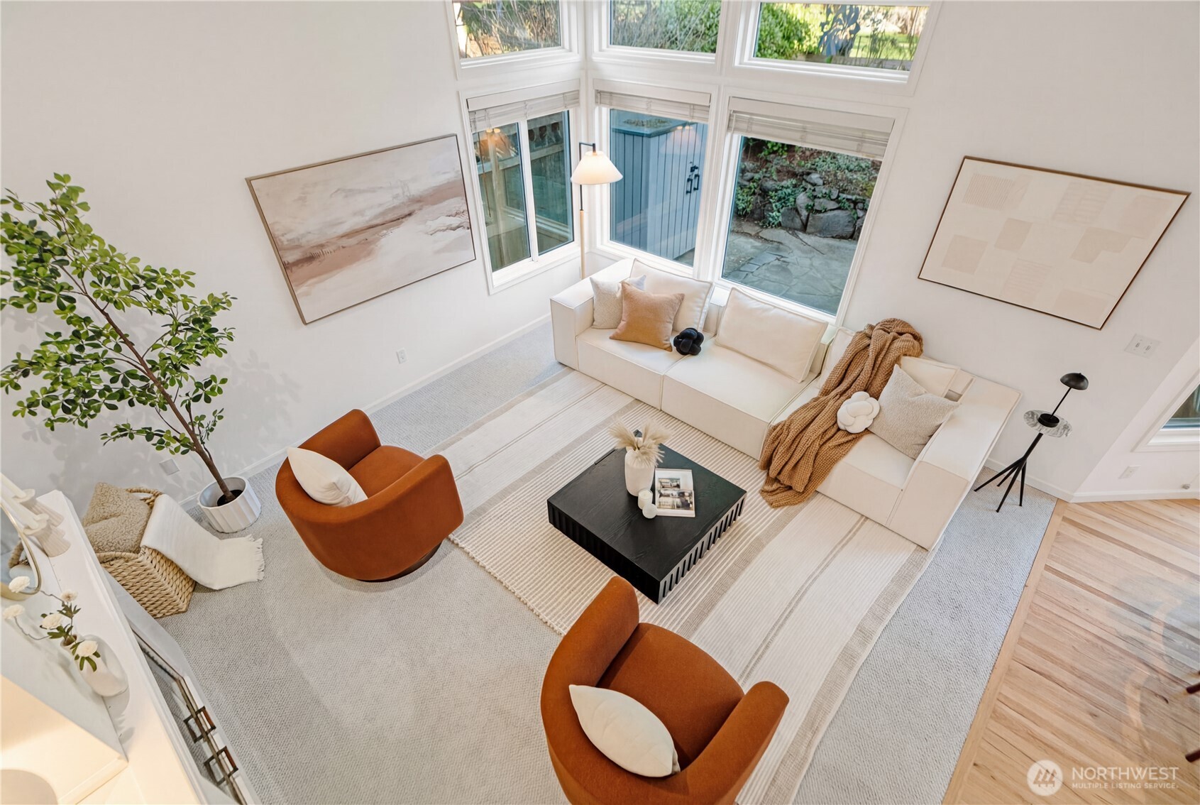 4016 243rd Place Southeast Issaquah, WA 98029 - Photo 15 of 35 a table with a couch and a potted plant