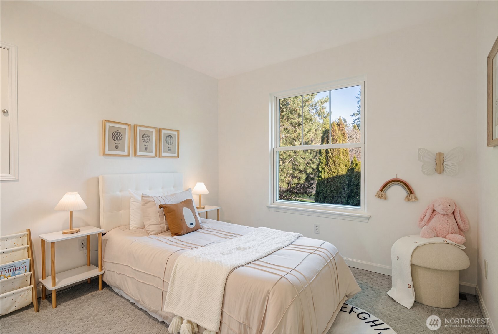 4016 243rd Place Southeast Issaquah, WA 98029 - Photo 18 of 35 a bedroom with a bed and a lamp