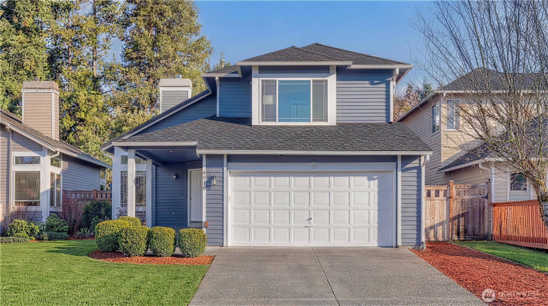 4016 243rd Place Southeast Issaquah, WA 98029 - Photo 25 of 35 a front view of a house with garden