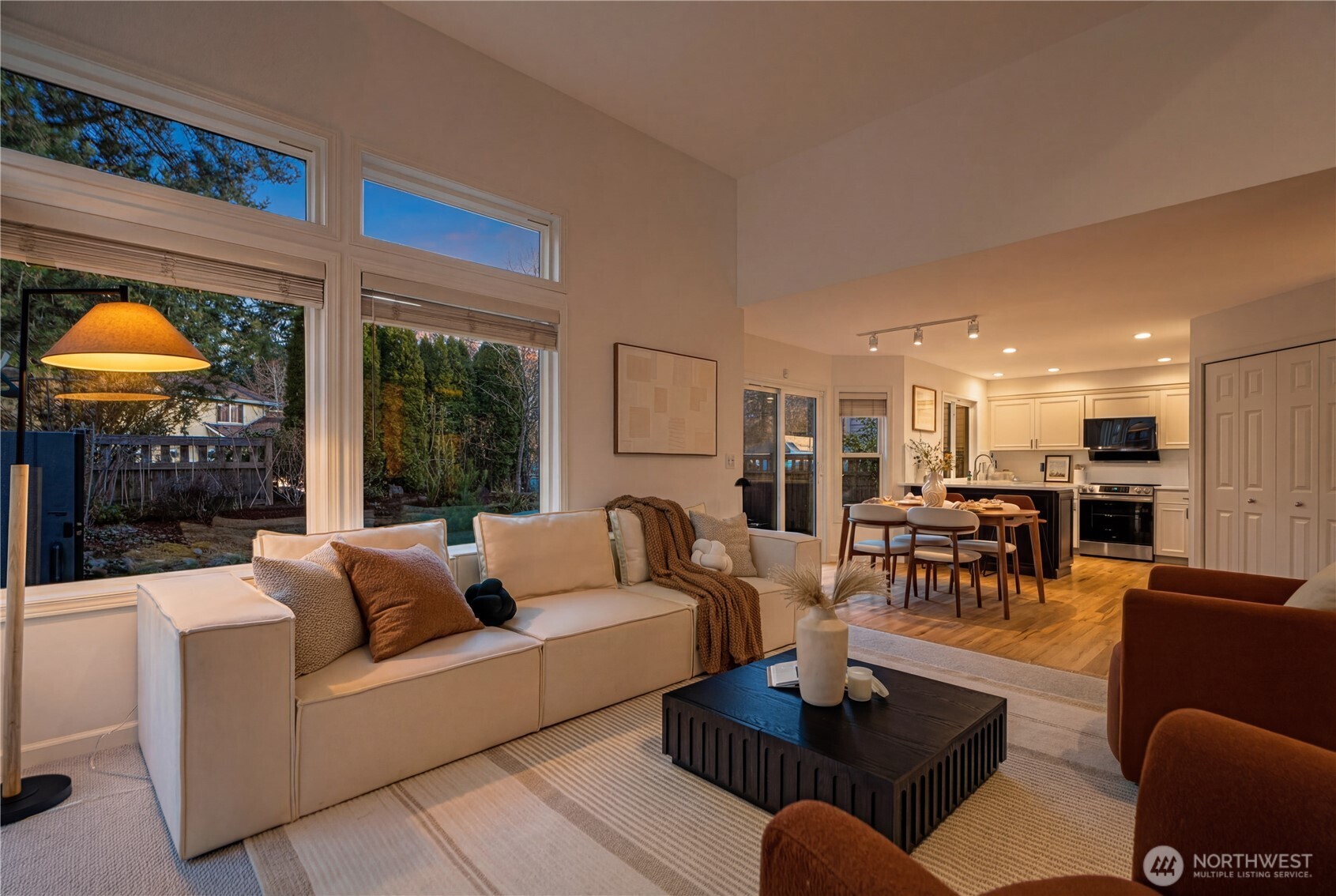 4016 243rd Place Southeast Issaquah, WA 98029 - Photo 30 of 35 a living room with furniture a rug and a floor to ceiling window