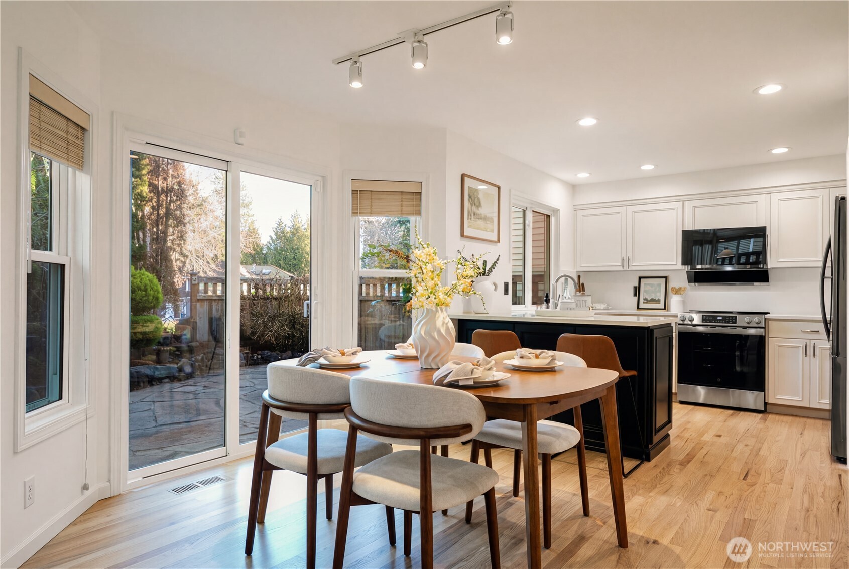 4016 243rd Place Southeast Issaquah, WA 98029 - Photo 8 of 35 a view of a dining room with furniture and wooden floor