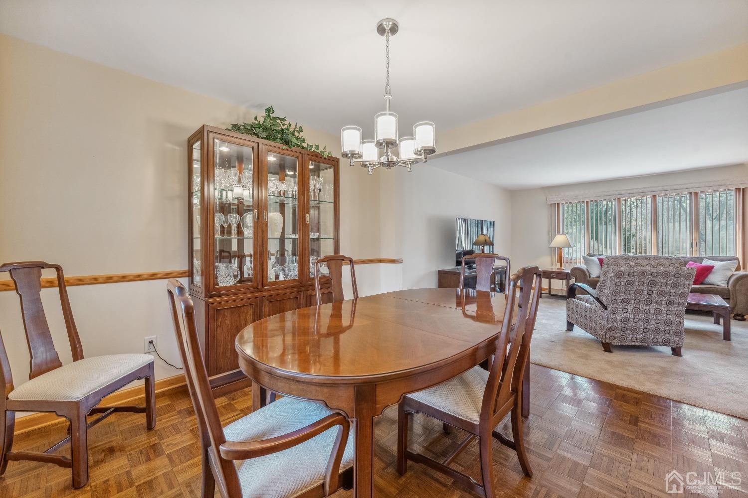 53 Bristol Road Piscataway, NJ 08854 - Photo 11 of 33 a dining room with furniture a chandelier and wooden floor