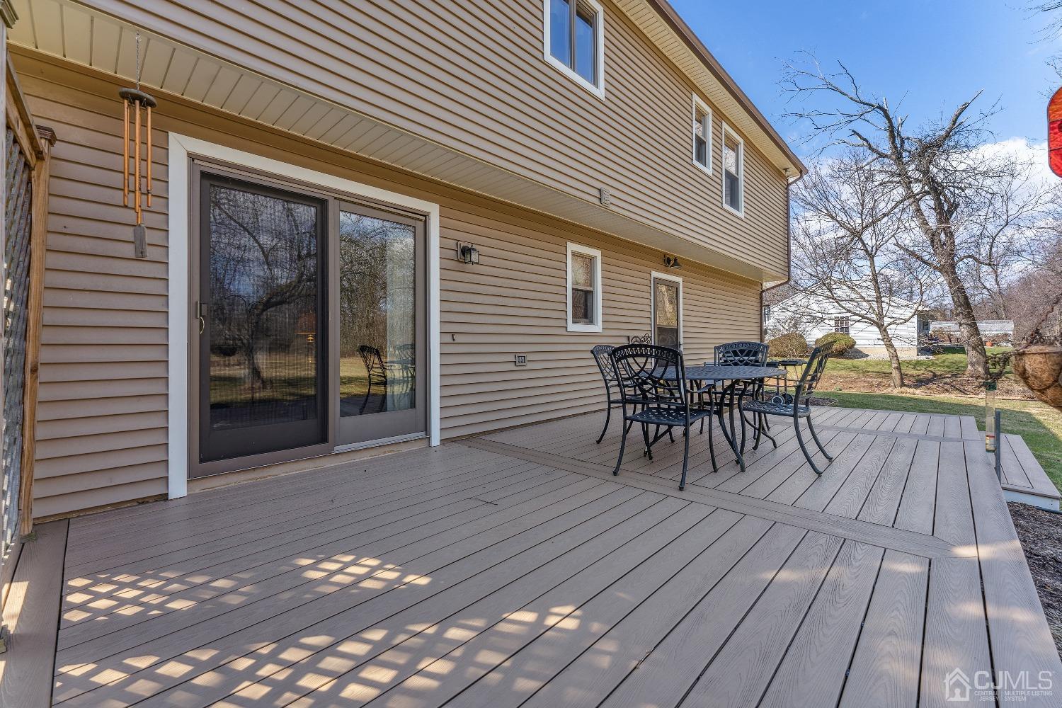 53 Bristol Road Piscataway, NJ 08854 - Photo 22 of 33 a view of a roof deck with table and chairs and wooden floor