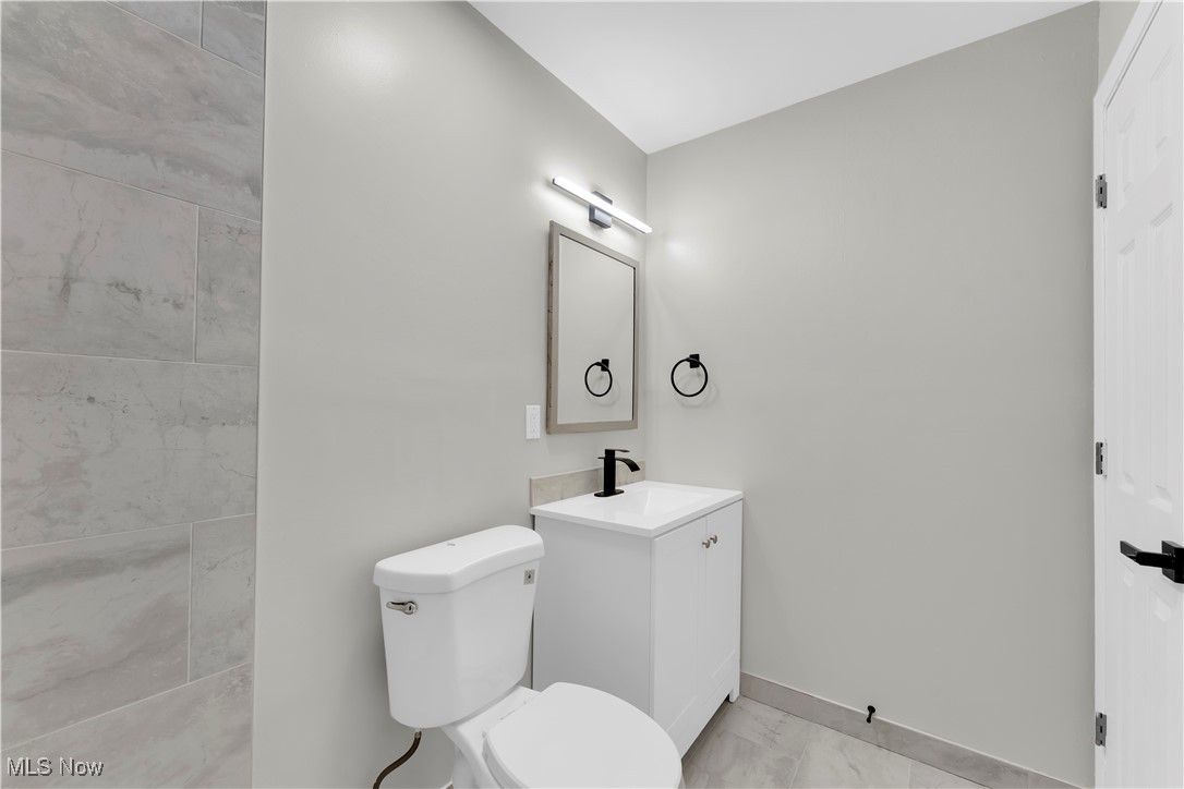797 Babbitt Road, Unit 15 Euclid, OH 44123 - Photo 19 of 22 Half bath with vanity and toilet