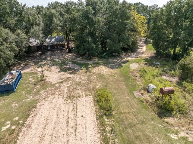 a view of a swimming pool and an outdoor seating