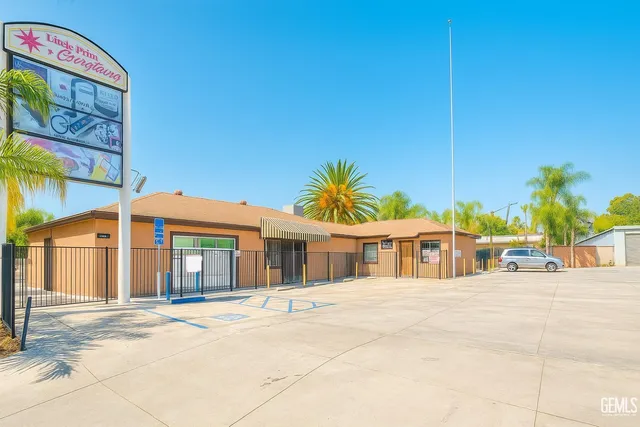 a view of an white house with a swimming pool