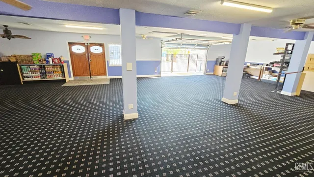 a view of a hallway with stairs