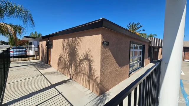 a view of house with a swimming pool