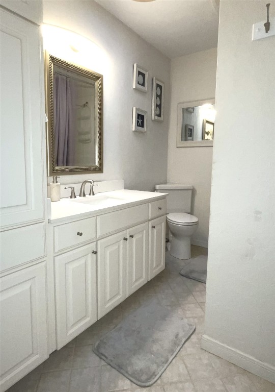 1914 West 38th Street Austin, TX 78731 - Photo 9 of 19 a spacious bathroom with a toilet sink and mirror