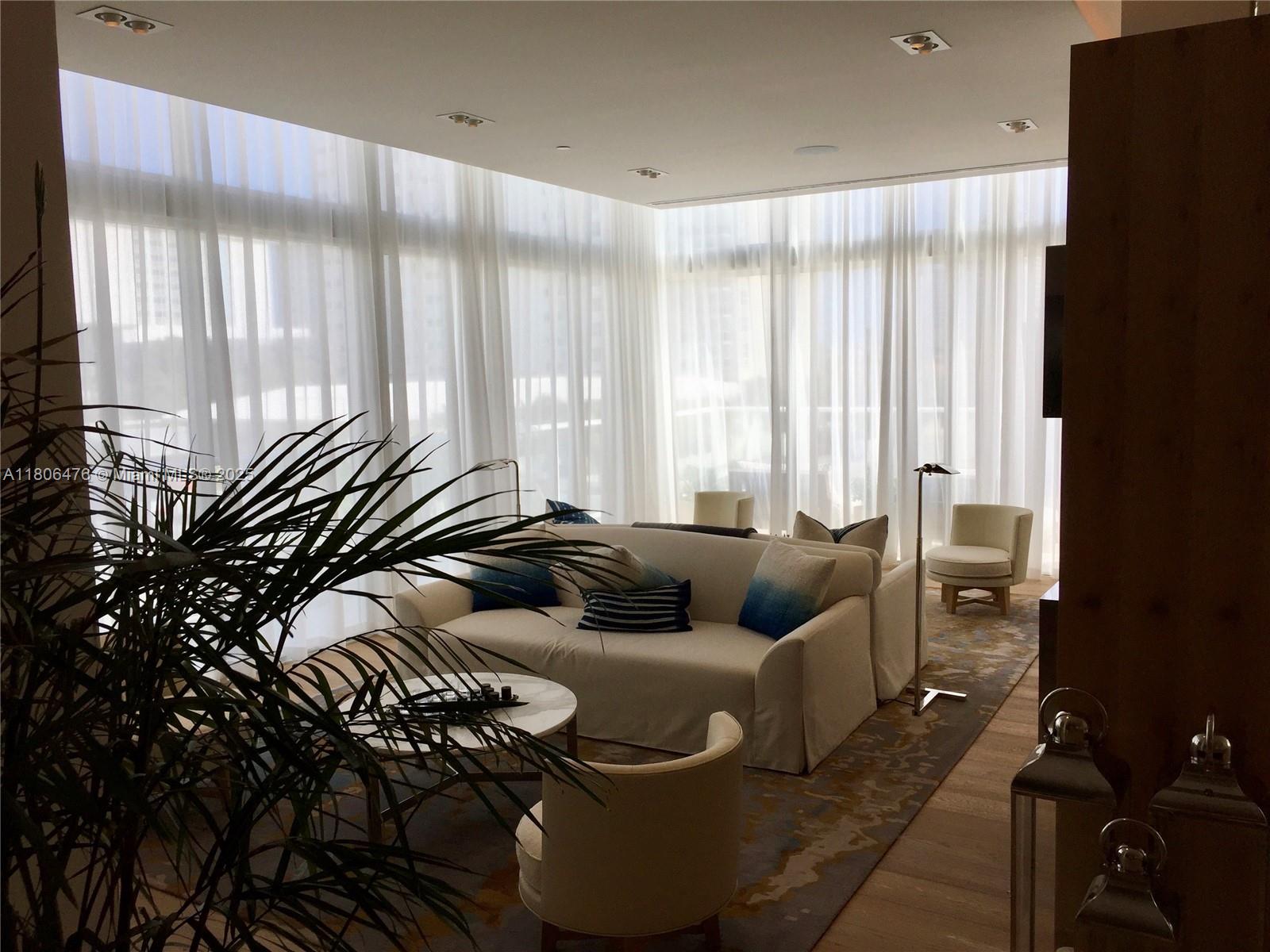 401 North Birch Road, Unit 505 Fort Lauderdale, FL 33304 - Photo 21 of 29 a living room with furniture and a large window