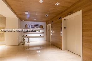 401 North Birch Road, Unit 505 Fort Lauderdale, FL 33304 - Photo 25 of 29 a view of a hallway and a livingroom with furniture