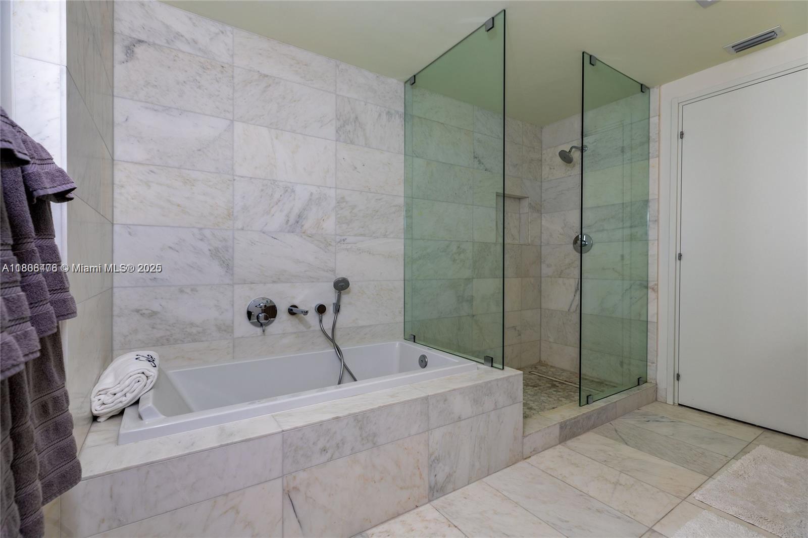 401 North Birch Road, Unit 505 Fort Lauderdale, FL 33304 - Photo 28 of 29 a bathroom with a bathtub and shower