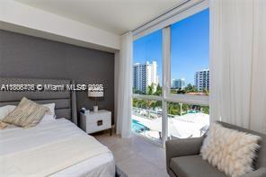 401 North Birch Road, Unit 505 Fort Lauderdale, FL 33304 - Photo 4 of 29 a bedroom with a bed and a window