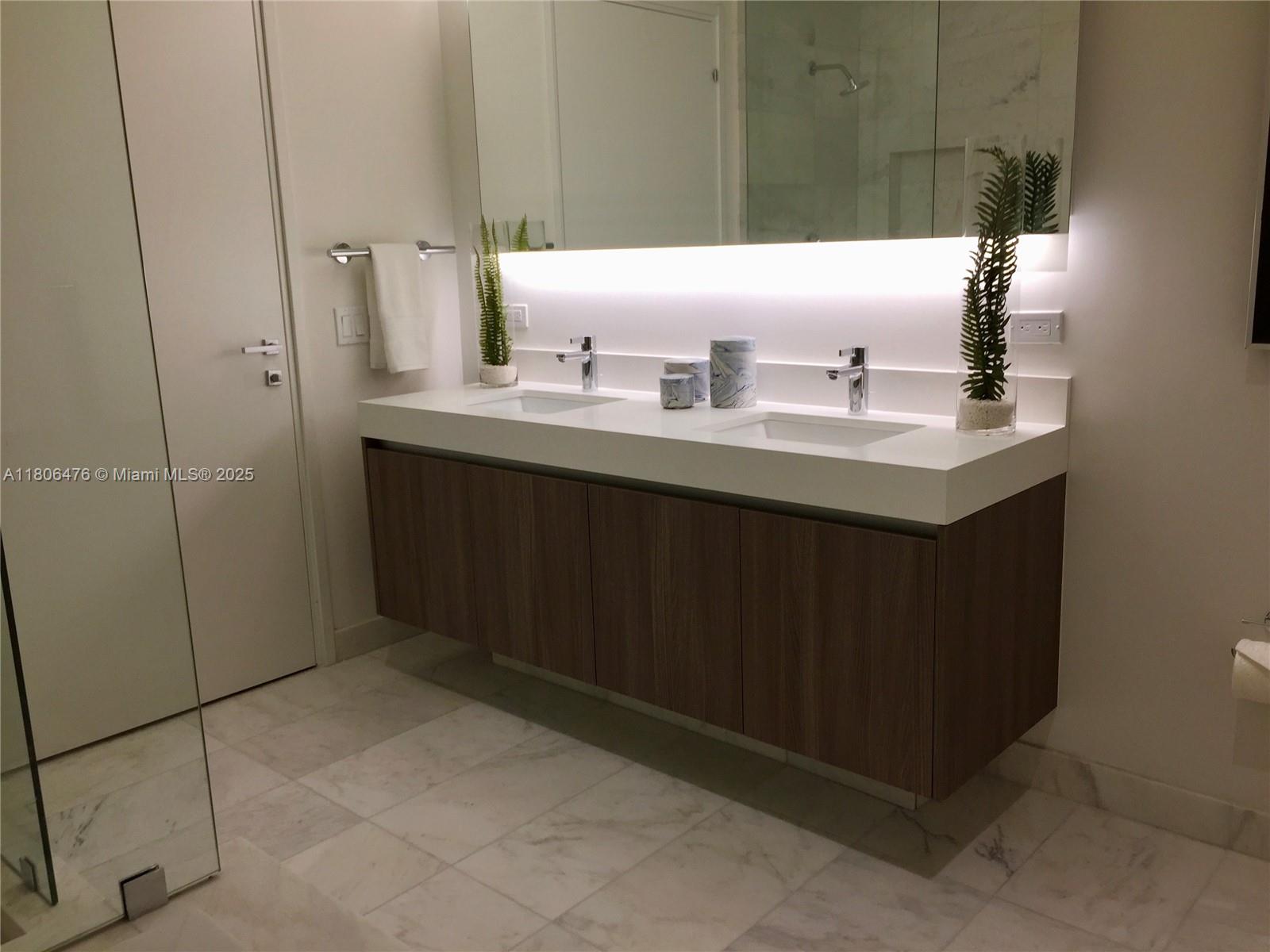 401 North Birch Road, Unit 505 Fort Lauderdale, FL 33304 - Photo 7 of 29 a bathroom with a sink and a mirror