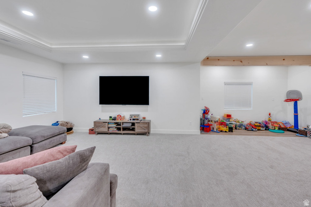 3452 Mapleton Hts Drive Mapleton, UT 84664 - Photo 26 of 40 Recessed lighting illuminates a spacious room featuring crown molding, neutral-toned carpeting, and a wood beam accent