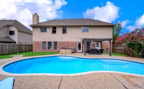 a view of pool with outdoor seating