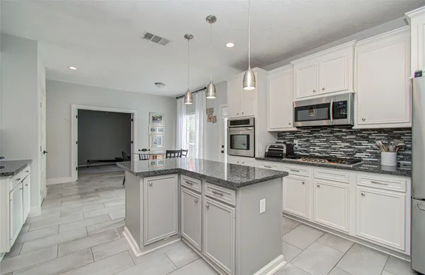 a kitchen with sink and cabinets