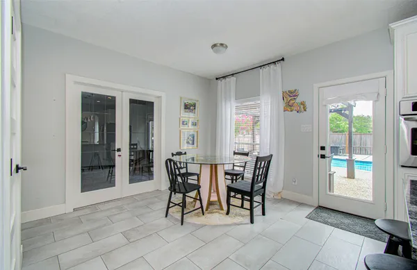 a view of a dining room with furniture and window