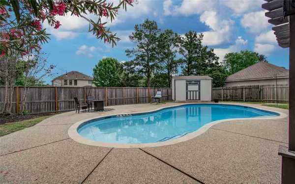 a view of a swimming pool with a patio