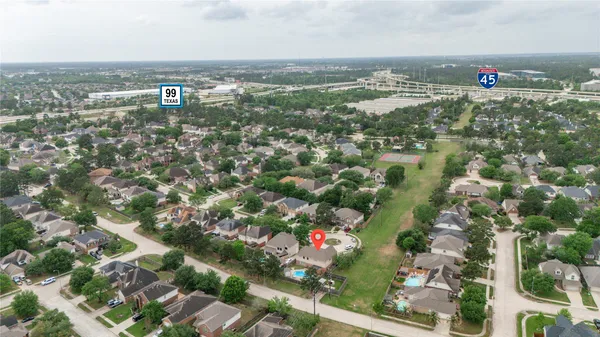 an aerial view of residential building and lake