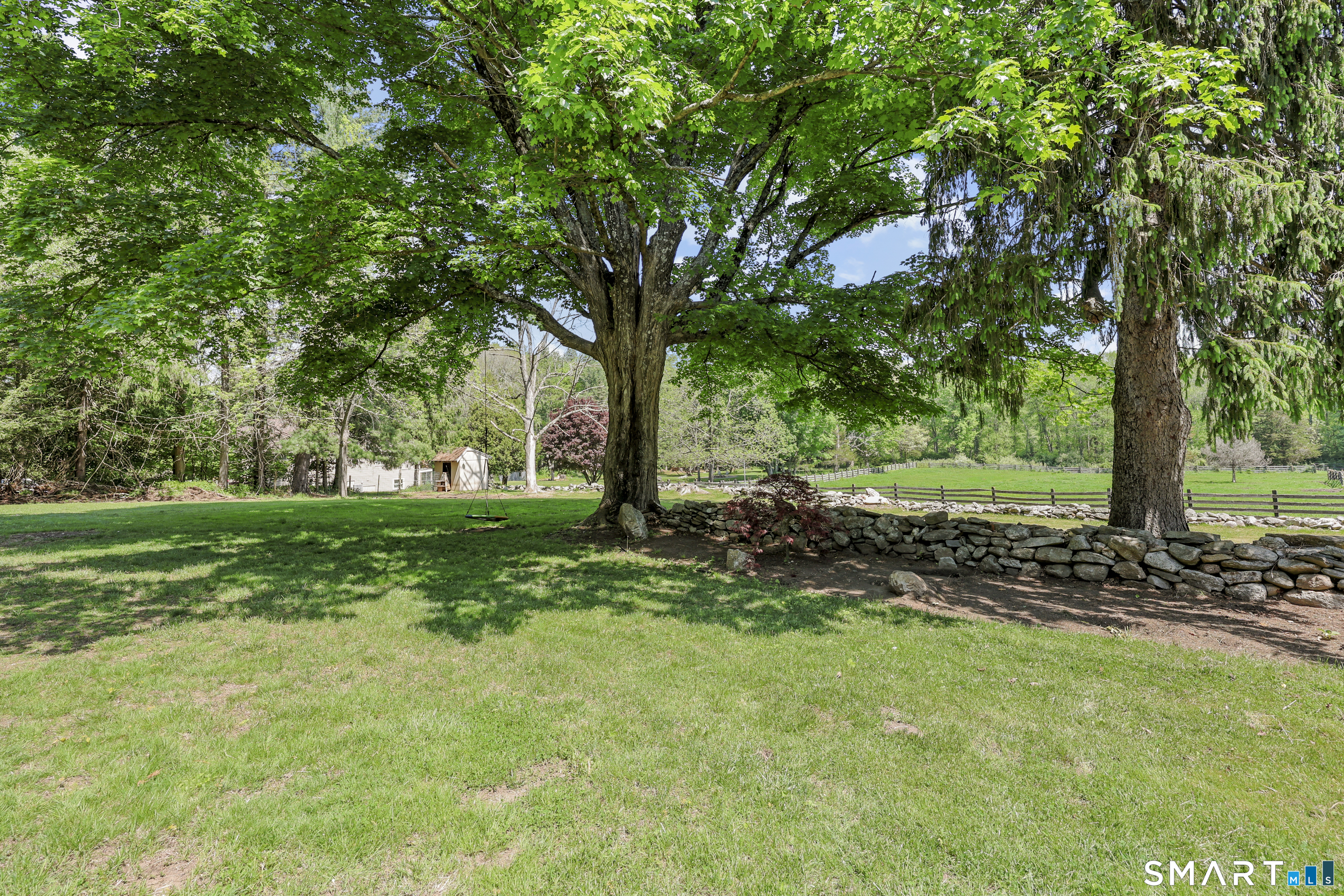 2880 Main Street Coventry, CT 06238 - Photo 31 of 40 Majestic shade trees allow a peak to paddocks just beyond.