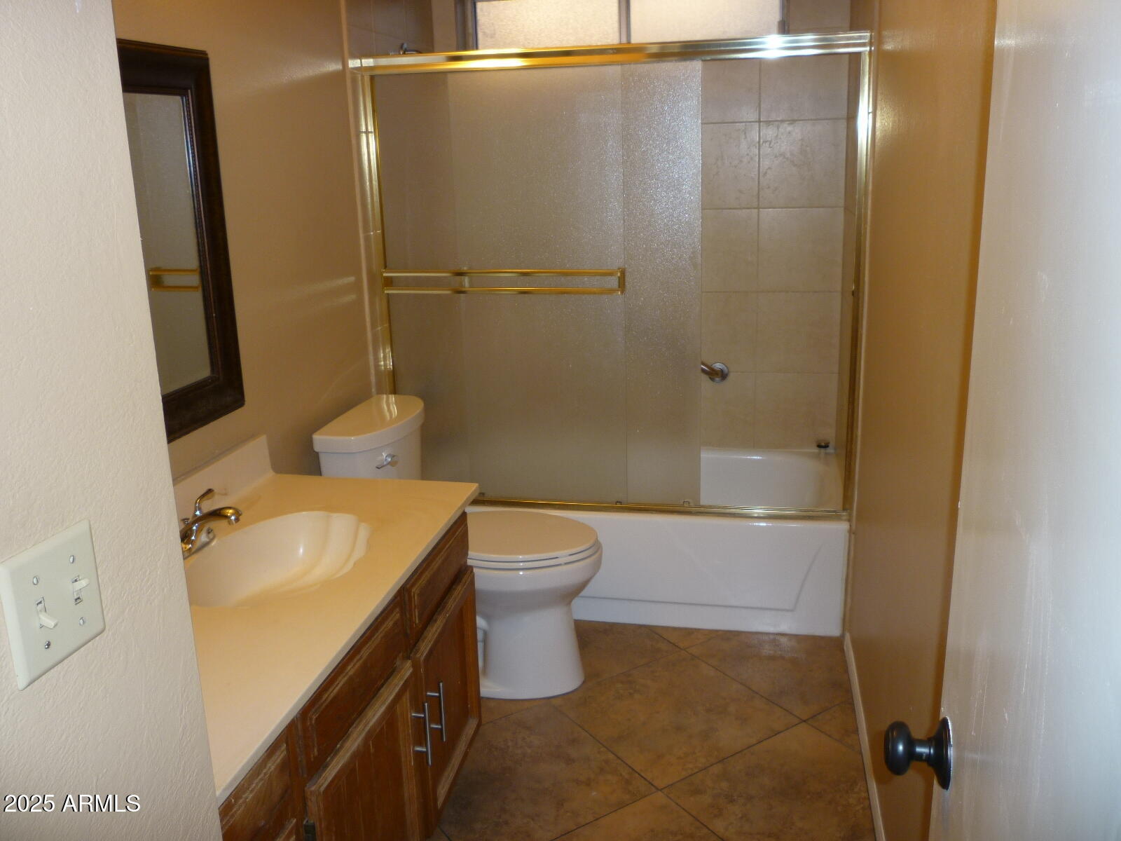 4216 West Willow Avenue Phoenix, AZ 85029 - Photo 11 of 14 a bathroom with a granite countertop sink toilet and shower